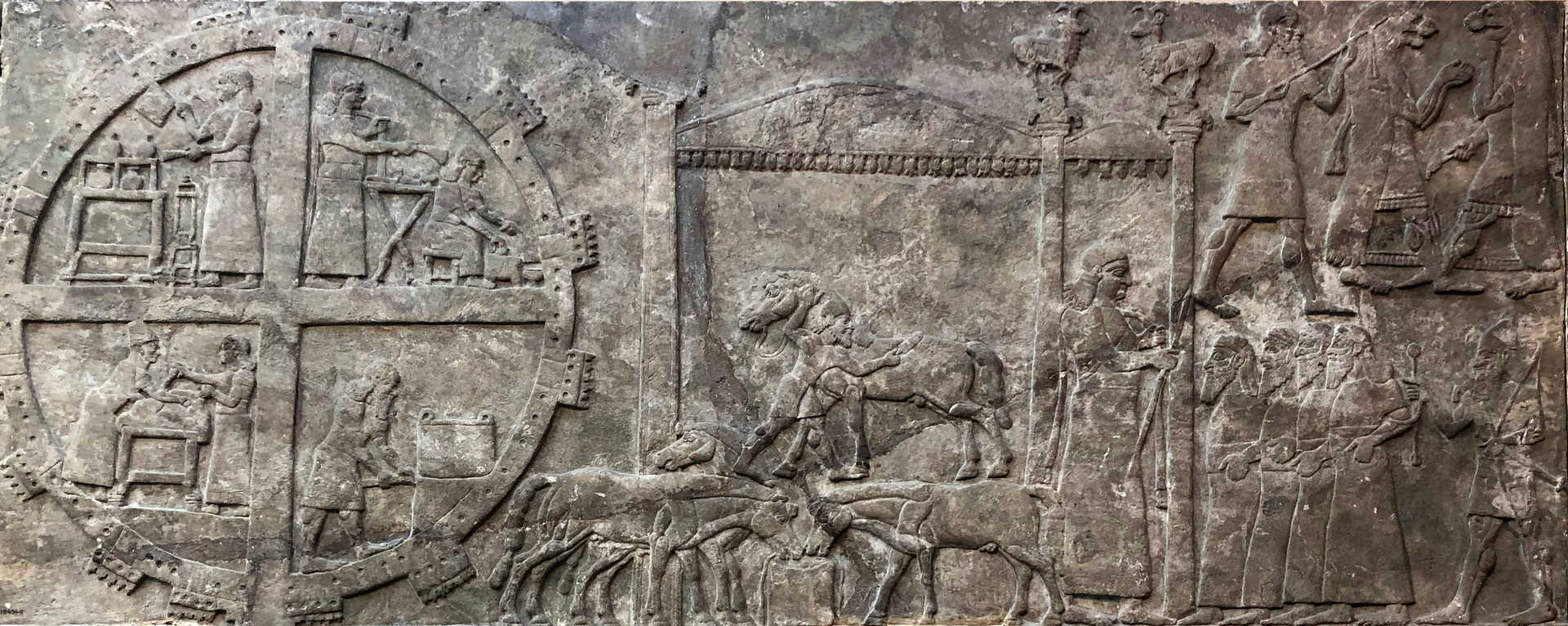 Bas-relief in British Museum of ancient Assyrian workers. Photographer: Sanjar Alimov (2018). License: Creative Commons Attribution-Share Alike 4.0 International — https://creativecommons.org/licenses/by-sa/4.0/deed.en. Photo cropped slightly and color adjusted for this use.